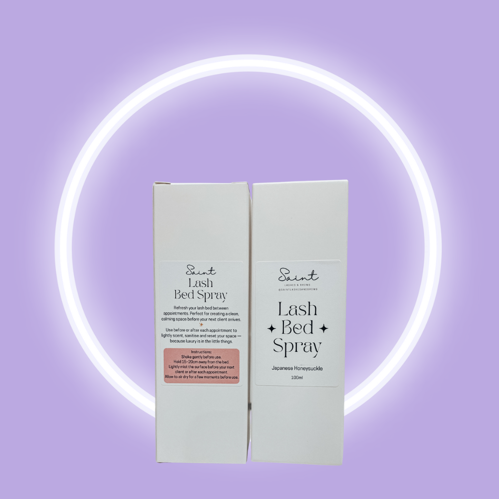 Two boxes of Scent Lash Bed Spray on a purple background with a neon light circle.